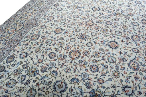 Backside of handmade 2000s Kashan rug showing knot structure and weave density