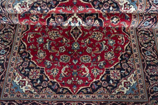Close-up detail of 2000s Kashan rug from Iran / Persia showing Wool weave