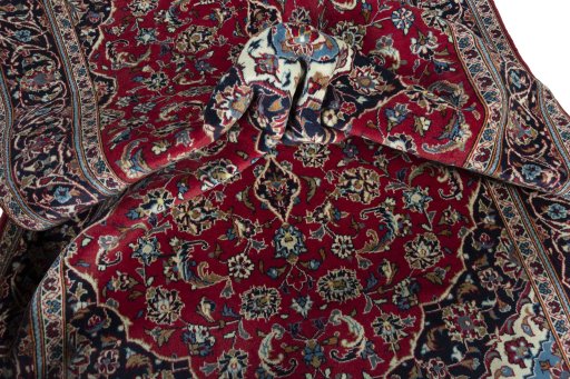 Surface texture of 2000s Kashan rug with natural Wool and intricate pattern