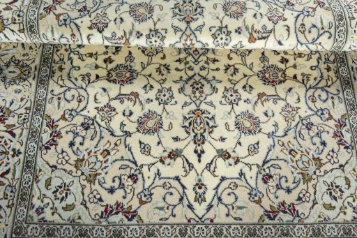 Close-up detail of 2000s Kashan rug from Iran / Persia showing Wool weave