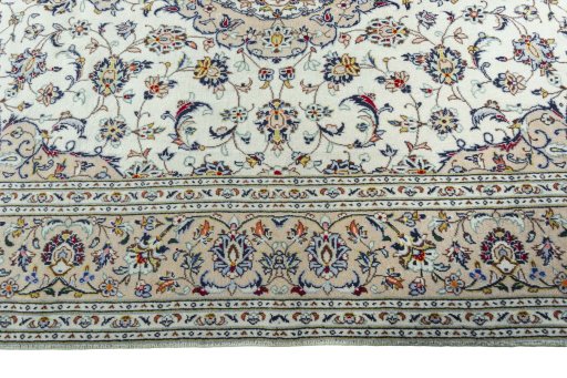 Corner detail of 2000s Kashan rug showing border pattern and Wool pile