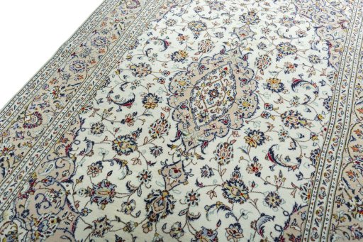 Backside of handmade 2000s Kashan rug showing knot structure and weave density