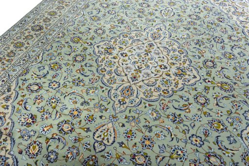 Backside of handmade 2000s Kashan rug showing knot structure and weave density