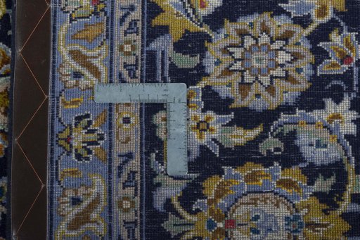Surface texture of 2000s Kashan rug with natural Wool and intricate pattern