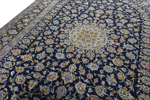 Backside of handmade 2000s Kashan rug showing knot structure and weave density