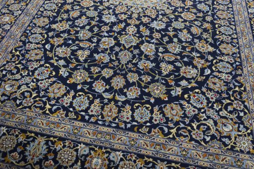 Close-up detail of 2000s Kashan rug from Iran / Persia showing Wool weave