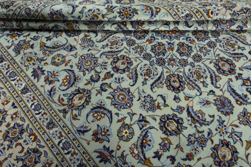 Close-up detail of 2000s Kashan rug from Iran / Persia showing Wool weave