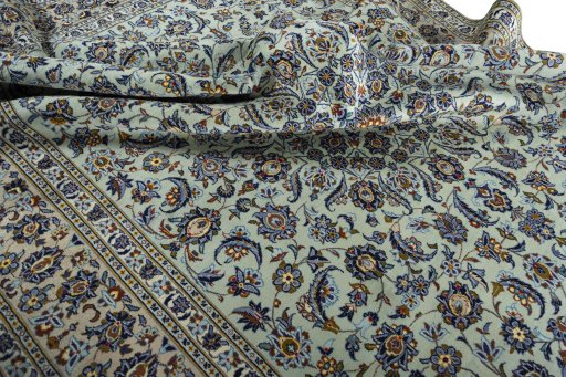 Surface texture of 2000s Kashan rug with natural Wool and intricate pattern