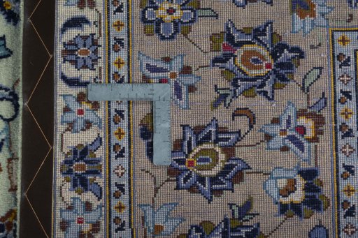 Backside of handmade 2000s Kashan rug showing knot structure and weave density