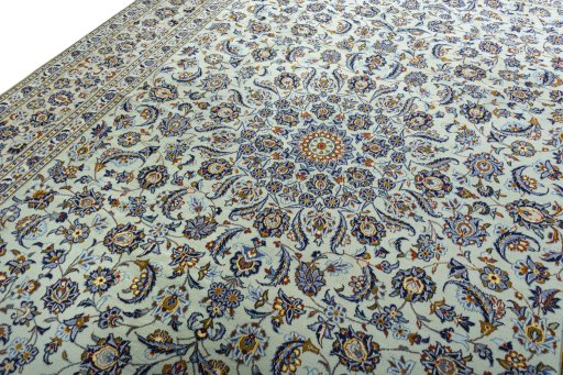 Backside of handmade 2000s Kashan rug showing knot structure and weave density