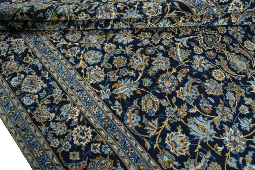 Close-up detail of 2000s Kashan rug from Iran / Persia showing Wool weave