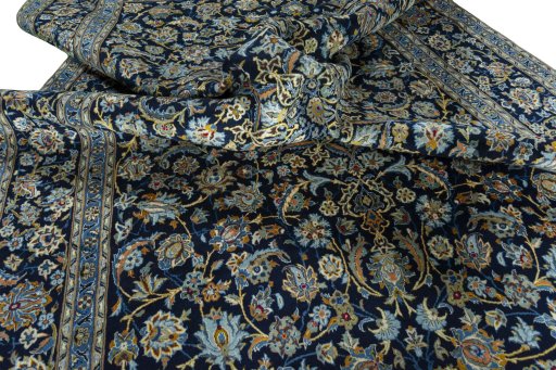 Surface texture of 2000s Kashan rug with natural Wool and intricate pattern