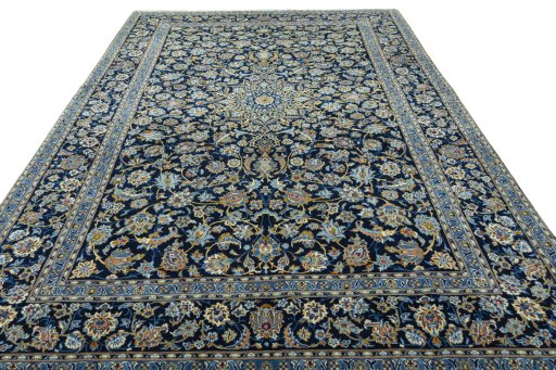 Surface texture of 2000s Kashan rug with natural Wool and intricate pattern