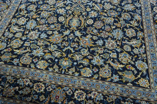 Close-up detail of 2000s Kashan rug from Iran / Persia showing Wool weave