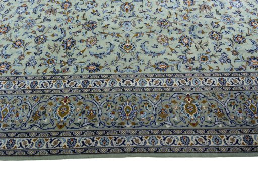 Corner detail of 2000s Kashan rug showing border pattern and Wool pile