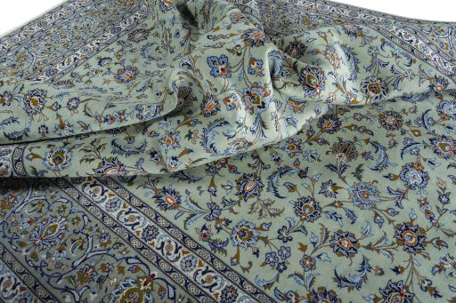 Surface texture of 2000s Kashan rug with natural Wool and intricate pattern