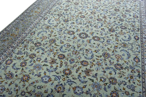 Backside of handmade 2000s Kashan rug showing knot structure and weave density