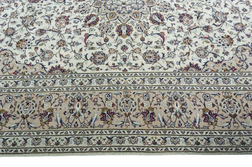 Corner detail of 2000s Kashan rug showing border pattern and Wool pile