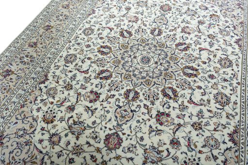 Backside of handmade 2000s Kashan rug showing knot structure and weave density