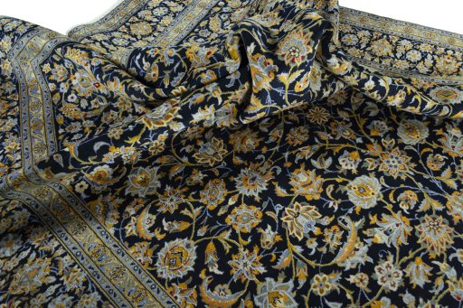 Surface texture of 2000s Kashan rug with natural Wool and intricate pattern