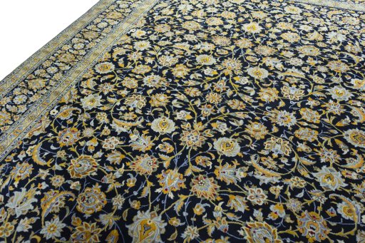 Backside of handmade 2000s Kashan rug showing knot structure and weave density