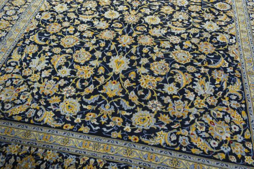 Close-up detail of 2000s Kashan rug from Iran / Persia showing Wool weave