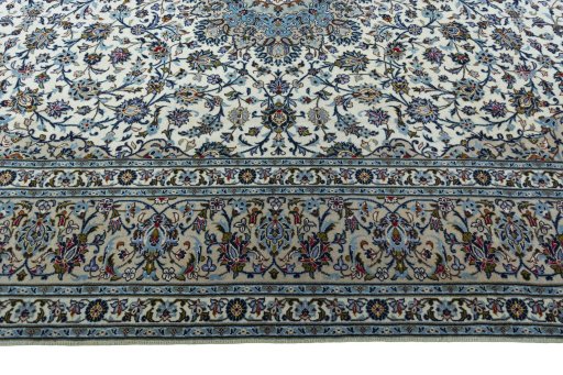 Corner detail of 2000s Kashan rug showing border pattern and Wool pile