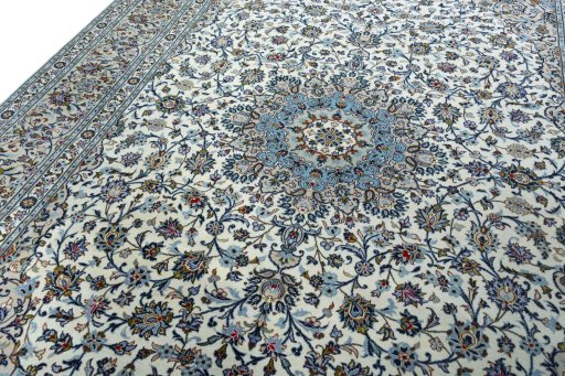 Backside of handmade 2000s Kashan rug showing knot structure and weave density