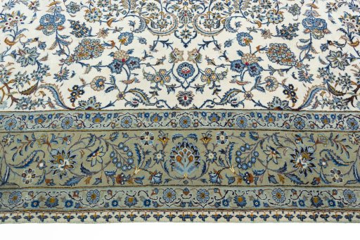Corner detail of 2000s Kashan rug showing border pattern and Wool pile