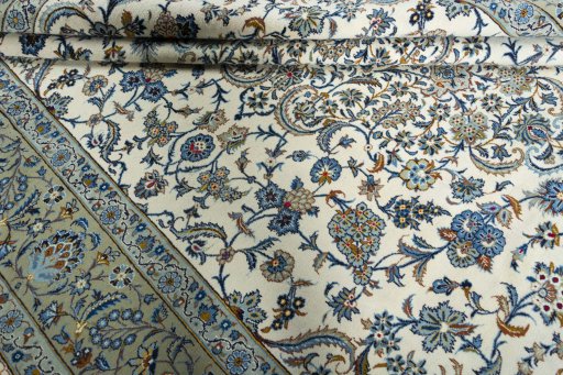 Surface texture of 2000s Kashan rug with natural Wool and intricate pattern