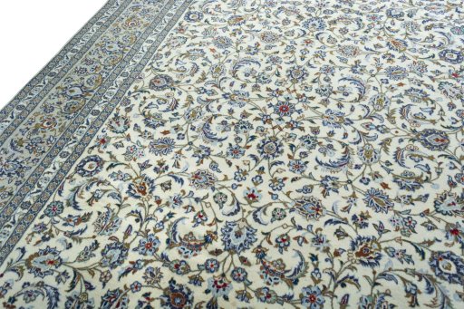 Backside of handmade 2000s Kashan rug showing knot structure and weave density