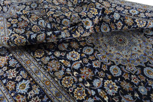 Surface texture of 2000s Kashan rug with natural Wool and intricate pattern