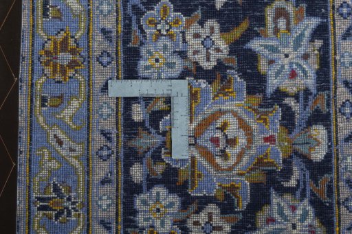 Backside of handmade 2000s Kashan rug showing knot structure and weave density