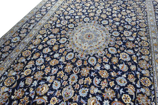 Backside of handmade 2000s Kashan rug showing knot structure and weave density