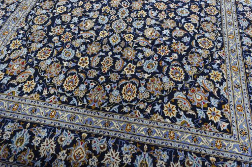 Close-up detail of 2000s Kashan rug from Iran / Persia showing Wool weave