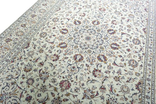 Backside of handmade 2000s Kashan rug showing knot structure and weave density