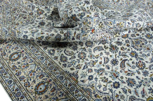 Surface texture of 2000s Kashan rug with natural Wool and intricate pattern