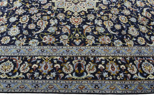 Corner detail of 1970s Kashan rug showing border pattern and Wool pile