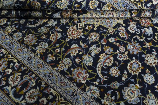 Close-up detail of 1970s Kashan rug from Iran / Persia showing Wool weave