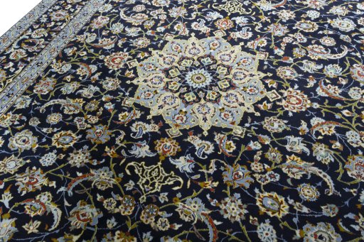 Backside of handmade 1970s Kashan rug showing knot structure and weave density