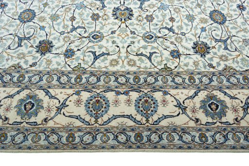 Corner detail of 2000s Kashan rug showing border pattern and Wool pile