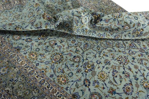 Surface texture of 2000s Kashan rug with natural Wool and intricate pattern