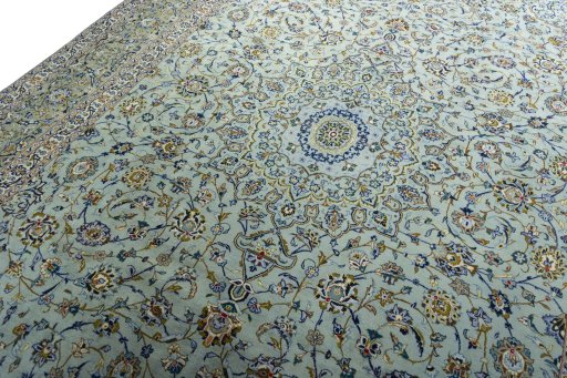 Backside of handmade 2000s Kashan rug showing knot structure and weave density
