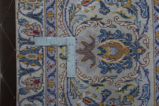 Backside of handmade 1970s Kashan rug showing knot structure and weave density