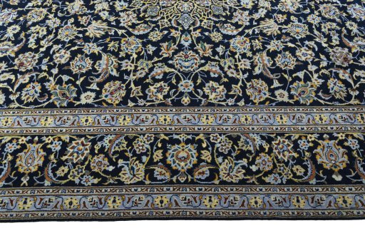 Corner detail of New Kashan rug showing border pattern and Wool pile