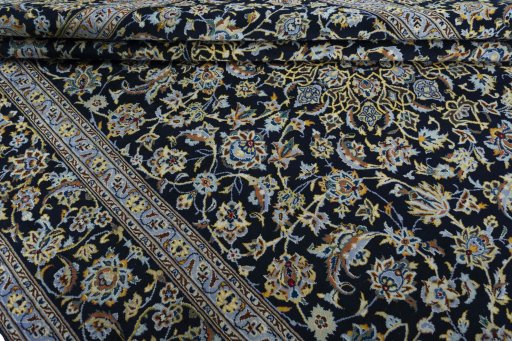 Close-up detail of New Kashan rug from Iran / Persia showing Wool weave