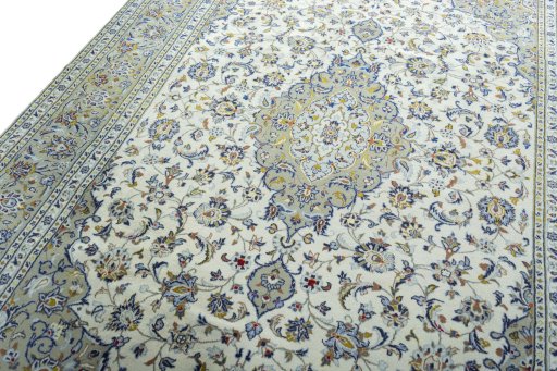 Backside of handmade 2000s Kashan rug showing knot structure and weave density