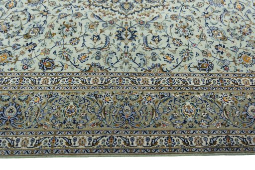 Corner detail of 2000s Kashan rug showing border pattern and Wool pile