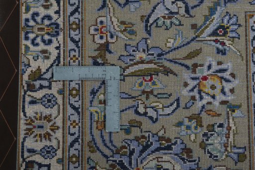 Backside of handmade 2000s Kashan rug showing knot structure and weave density