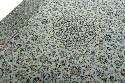 Backside of handmade 2000s Kashan rug showing knot structure and weave density